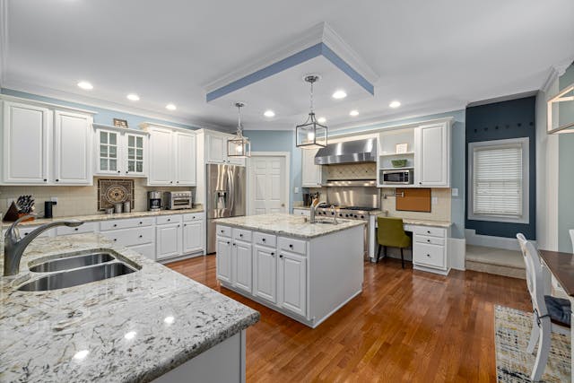 kitchen-with-white-cabinets-granite-counters-and-hard-wood-flooring kitchen-with-white-cabinets-granite-counters-and-hard-wood-flooring